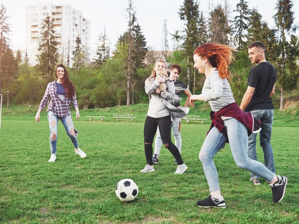 Team Playing Soccer Match Outdoor